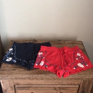 Navy flowy embroidered shorts and red shorts